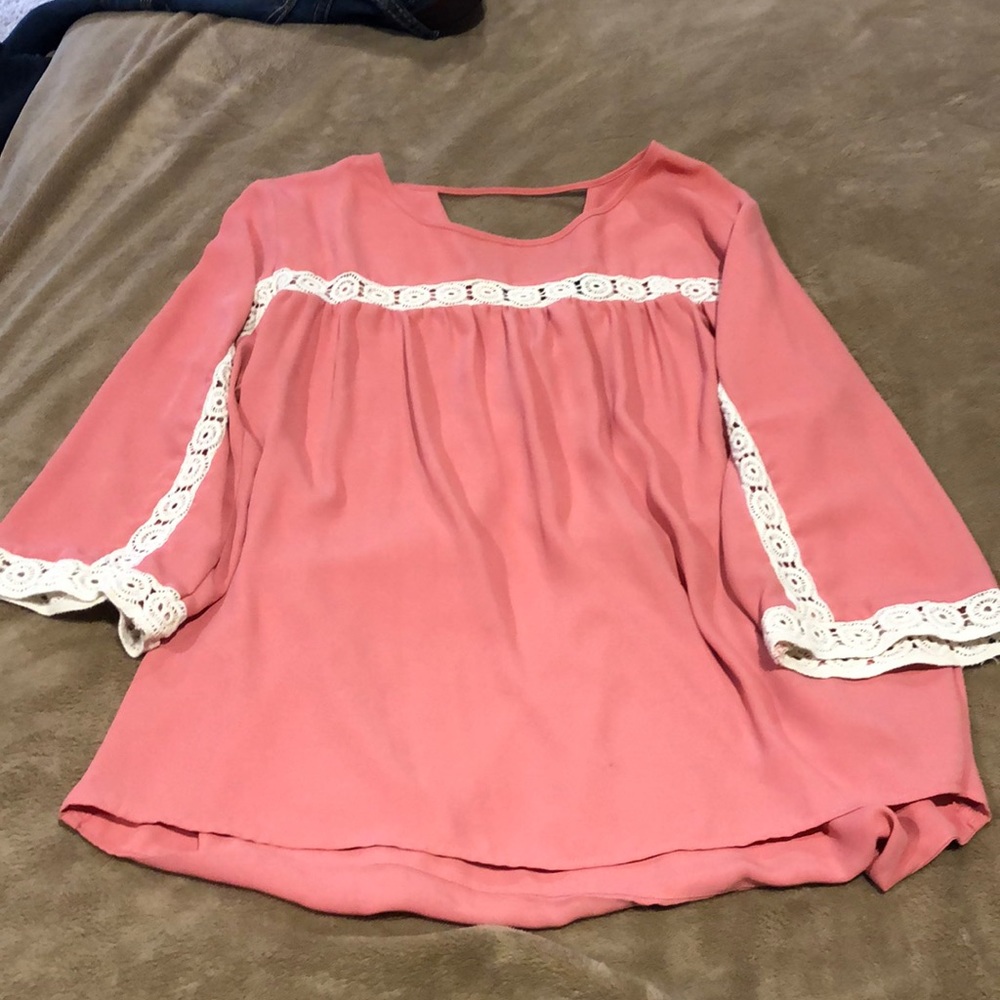 Blush pink blouse.